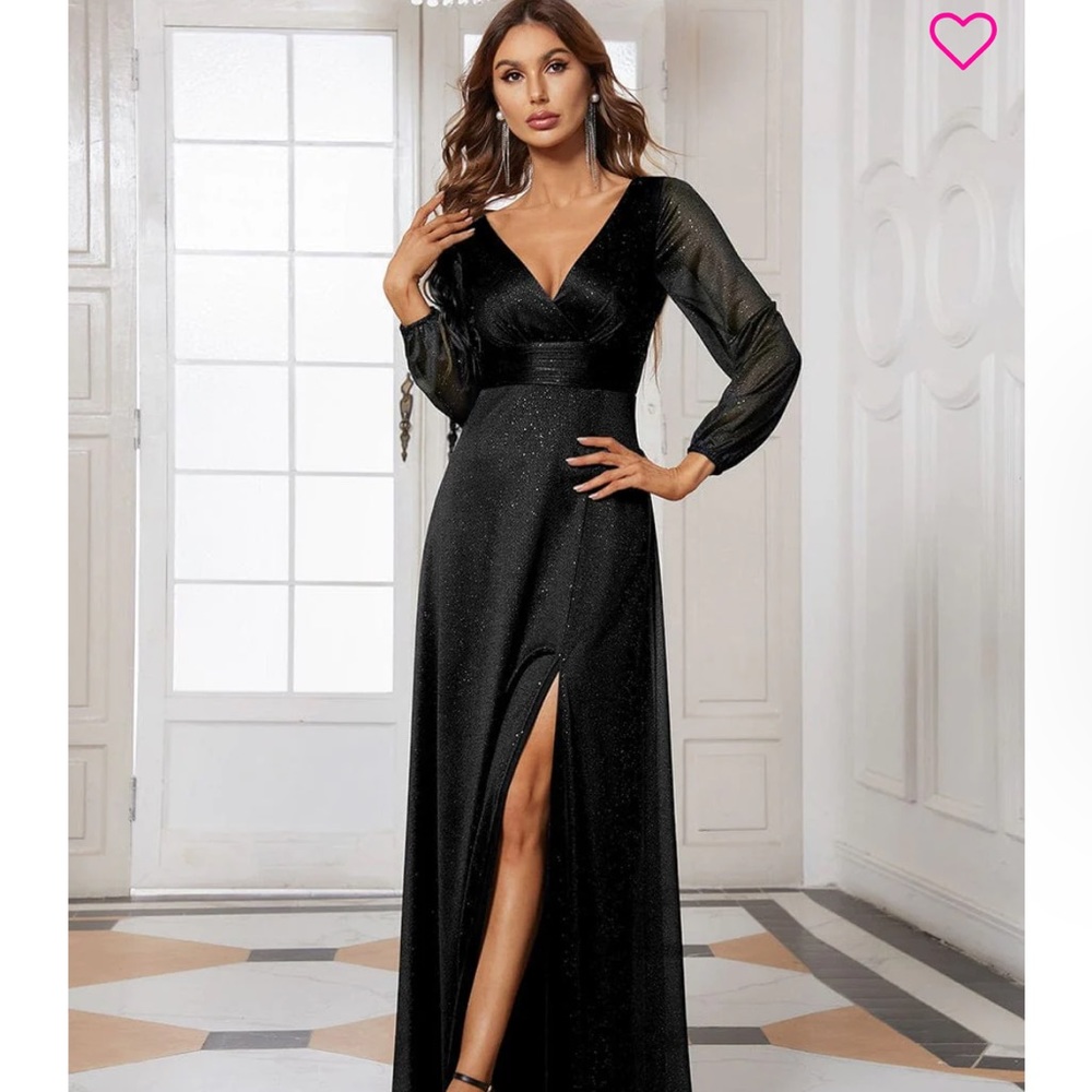 Long, black, formal dress with sheer long sleeves and glittery fabric.